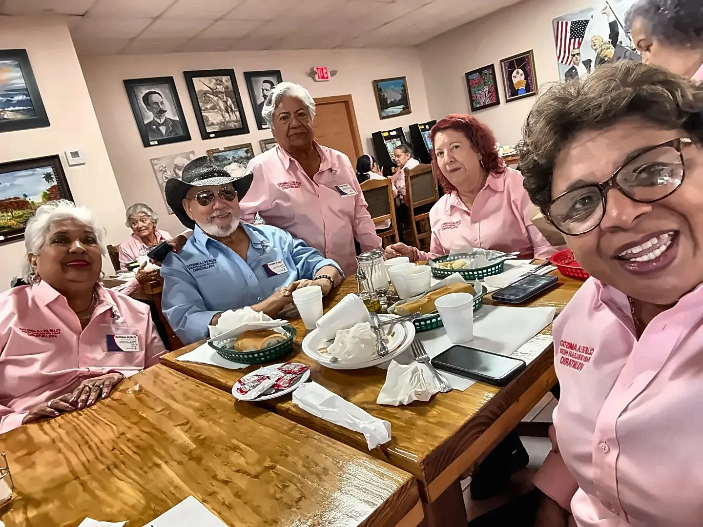 Club volunteers at a monthly meeting around a table